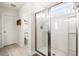 Bright bathroom with a glass shower enclosure and a separate toilet room with tiled floors at 1532 Roustabout Way, Charleston, SC 29414
