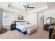 Bedroom featuring a tray ceiling, neutral carpet, lots of light from the windows, and ensuite bathroom at 1532 Roustabout Way, Charleston, SC 29414