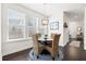 Charming dining area with wicker chairs, hardwood floors, and ample natural light at 1532 Roustabout Way, Charleston, SC 29414