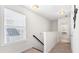 Upstairs hallway featuring natural light and access to multiple rooms at 1532 Roustabout Way, Charleston, SC 29414