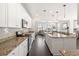 Open kitchen featuring a large island, stainless steel appliances, and seamless flow to the living area at 1532 Roustabout Way, Charleston, SC 29414