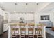 Bright eat-in kitchen boasts a large island with bar stool seating and pendant lighting at 1532 Roustabout Way, Charleston, SC 29414