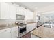 Bright kitchen with stainless steel appliances, granite countertops, and tile backsplash at 1532 Roustabout Way, Charleston, SC 29414