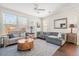 Sun-filled living room with hardwood floors, neutral tones, and stylish decor at 1532 Roustabout Way, Charleston, SC 29414