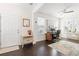 Brightly lit home office features a large window, desk, and comfortable seating at 1532 Roustabout Way, Charleston, SC 29414