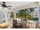 Relaxing covered porch with a fan, seating, and flower boxes, perfect for enjoying the outdoors at 1532 Roustabout Way, Charleston, SC 29414