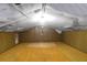 This carpeted attic space has wood-paneled walls and a white-fabric ceiling at 1595 Dickens St, Charleston, SC 29407