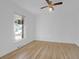 A cozy bedroom filled with natural light showcasing hardwood floors, and a neutral color palette at 1595 Dickens St, Charleston, SC 29407