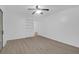 Neutral living room showcases a ceiling fan, built-in shelves, and modern flooring at 1595 Dickens St, Charleston, SC 29407