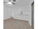 Bright living room features neutral walls, ceiling fan, and modern flooring at 1595 Dickens St, Charleston, SC 29407