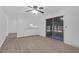 Bright living room features neutral walls, ceiling fan, and modern flooring at 1595 Dickens St, Charleston, SC 29407
