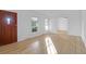 Inviting living room with new hardwood floors, fresh white paint and natural light at 1595 Dickens St, Charleston, SC 29407