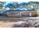 Back of the house featuring an enclosed porch and brick exterior at 1595 Dickens St, Charleston, SC 29407