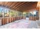 Spacious sunroom features an unfinished interior with a wooden beamed ceiling and multiple windows at 1595 Dickens St, Charleston, SC 29407