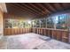 Large sunroom featuring an unfinished interior with multiple windows and a wood ceiling at 1595 Dickens St, Charleston, SC 29407