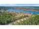 Scenic aerial view of a residential neighborhood nestled beside a tranquil lake and dense trees at 1633 Pimlico Blvd, Moncks Corner, SC 29461