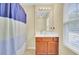 Bathroom featuring a vanity with cabinet, a well-lit mirror, and a shower with a curtain, offering functionality at 1633 Pimlico Blvd, Moncks Corner, SC 29461