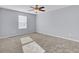 Spacious bedroom with lots of light, with plush carpeting, offering a serene and comfortable living space at 1633 Pimlico Blvd, Moncks Corner, SC 29461