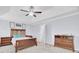 A cozy bedroom featuring a decorative bed frame, and coordinated furniture set on plush carpet at 1633 Pimlico Blvd, Moncks Corner, SC 29461