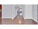 Inviting entryway with sleek hardwood floors and neutral walls leading into a spacious living area at 1633 Pimlico Blvd, Moncks Corner, SC 29461
