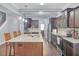 Beautiful kitchen with dark cabinetry, granite countertops, stainless steel appliances, and a large island at 1633 Pimlico Blvd, Moncks Corner, SC 29461