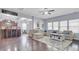 Bright and airy living room with hardwood floors, a large sectional sofa, and open access to the kitchen at 1633 Pimlico Blvd, Moncks Corner, SC 29461