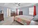 Spacious main bedroom featuring large windows for lots of light, tray ceilings, and neutral decor at 1633 Pimlico Blvd, Moncks Corner, SC 29461