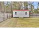 Outdoor storage shed with a red roof in the fenced-in backyard offers ample space at 1633 Pimlico Blvd, Moncks Corner, SC 29461