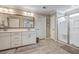 Bathroom features dual sinks, white cabinets, and a glass enclosed shower at 1644 Fishbone Dr, Johns Island, SC 29455