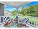 Inviting covered porch with comfortable seating, perfect for relaxing and enjoying the outdoors at 1644 Fishbone Dr, Johns Island, SC 29455