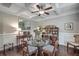 Bright dining room boasts coffered ceilings, hardwood floors, and a glass-topped table at 1644 Fishbone Dr, Johns Island, SC 29455