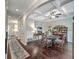 Open-concept dining room showcases dark hardwood floors, coffered ceilings and seamless transition into other living areas at 1644 Fishbone Dr, Johns Island, SC 29455