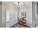 Cozy entryway featuring wood floors, a decor shelf, and a stylish front door with sidelights at 1644 Fishbone Dr, Johns Island, SC 29455