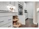 Kitchen showcases white cabinetry, open drawers, stainless steel appliances, and hardwood floors at 1644 Fishbone Dr, Johns Island, SC 29455