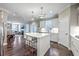 Open concept kitchen features a large island with seating, white cabinets, and stainless steel appliances at 1644 Fishbone Dr, Johns Island, SC 29455