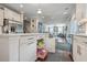 Kitchen showcasing white cabinets, open drawers, stainless steel appliances, and hardwood floors at 1644 Fishbone Dr, Johns Island, SC 29455