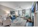 Spacious living room with built-in shelving, fireplace, and comfortable seating, bathed in natural light at 1644 Fishbone Dr, Johns Island, SC 29455