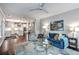 Bright living room features an open floor plan, wood floors, and seamless transition into the kitchen at 1644 Fishbone Dr, Johns Island, SC 29455