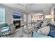 Open living room features a fireplace, a ceiling fan, and seamless transition into the kitchen at 1644 Fishbone Dr, Johns Island, SC 29455