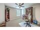 This office features neutral walls, natural light, and a ceiling fan at 1644 Fishbone Dr, Johns Island, SC 29455