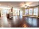 Open-concept living room featuring hardwood floors, large windows, and sliding door access to outdoor space at 173 Cypress Forest Dr, Moncks Corner, SC 29461