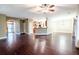 Open concept living room and kitchen featuring dark wood floors at 173 Cypress Forest Dr, Moncks Corner, SC 29461
