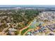 Expansive aerial view of a residential community, highlighting lush greenery, serene ponds, and attractive housing at 1756 Timmons St, Mount Pleasant, SC 29466