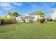Beautiful backyard with a well-maintained lawn and an inviting patio area, perfect for outdoor entertaining at 1756 Timmons St, Mount Pleasant, SC 29466