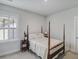 Cozy bedroom featuring a four-poster bed, soft lighting, and serene ambiance, a peaceful retreat at 1756 Timmons St, Mount Pleasant, SC 29466