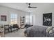 Comfortable bedroom with neutral decor, a ceiling fan, and plenty of natural light from the window at 1756 Timmons St, Mount Pleasant, SC 29466