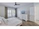 Bedroom featuring neutral tones, shuttered windows and a television at 1756 Timmons St, Mount Pleasant, SC 29466