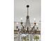 Elegant chandelier with candle-style lights and beaded accents providing soft, ambient illumination at 1756 Timmons St, Mount Pleasant, SC 29466