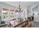 Dining room with a large table, chandelier, shutters, and lots of natural light at 1756 Timmons St, Mount Pleasant, SC 29466