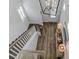 Bright foyer featuring wood floors, staircase, shiplap accent wall, and contemporary chandelier at 1756 Timmons St, Mount Pleasant, SC 29466